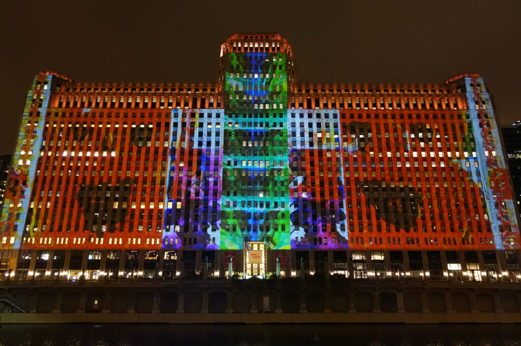 Architectural building integration featuring a large-scale outdoor LED screen display and architectural digital lighting.